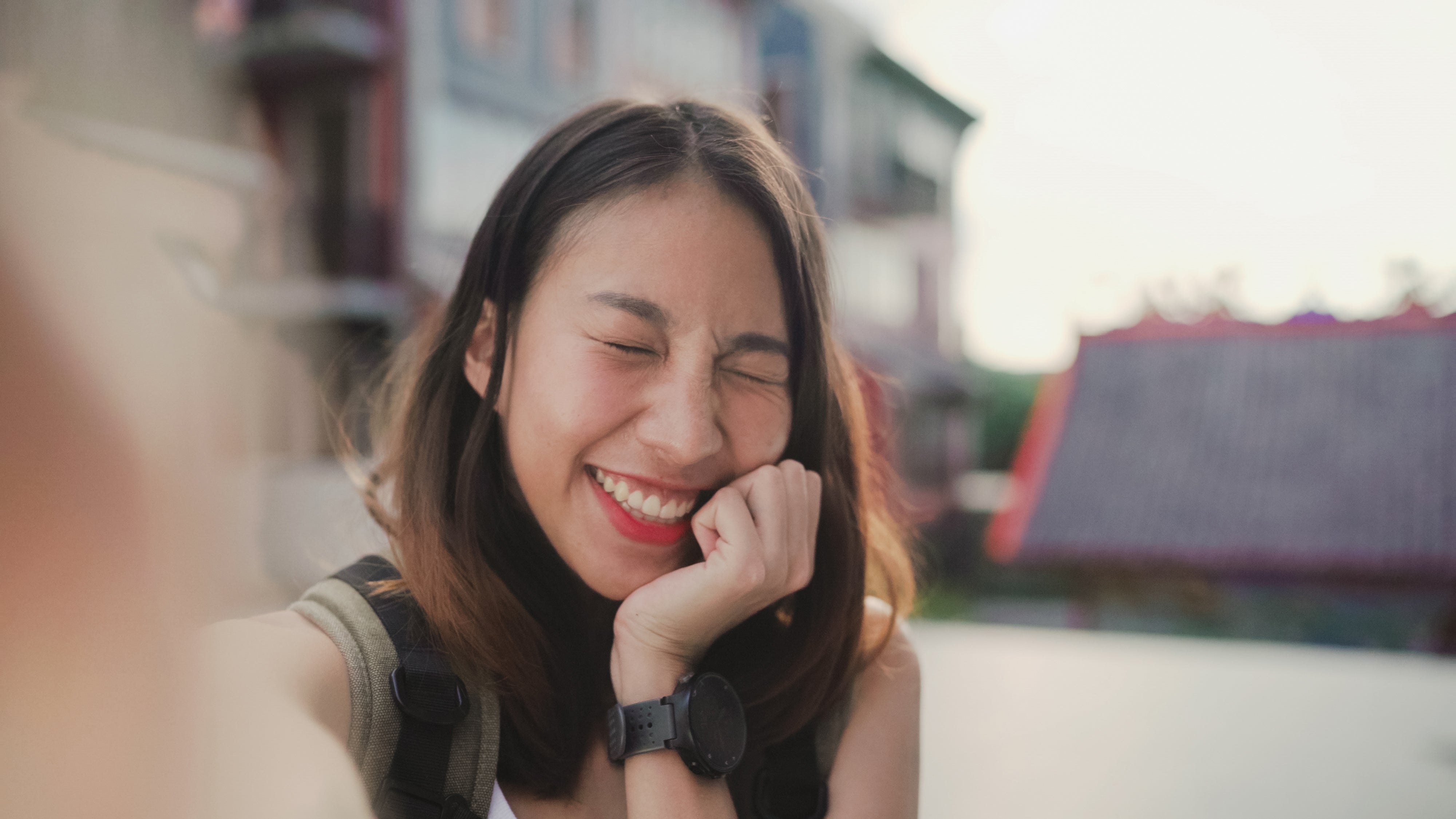 files/cheerful-beautiful-young-asian-backpacker-blogger-woman-using-smartphone-taking-selfie.jpg
